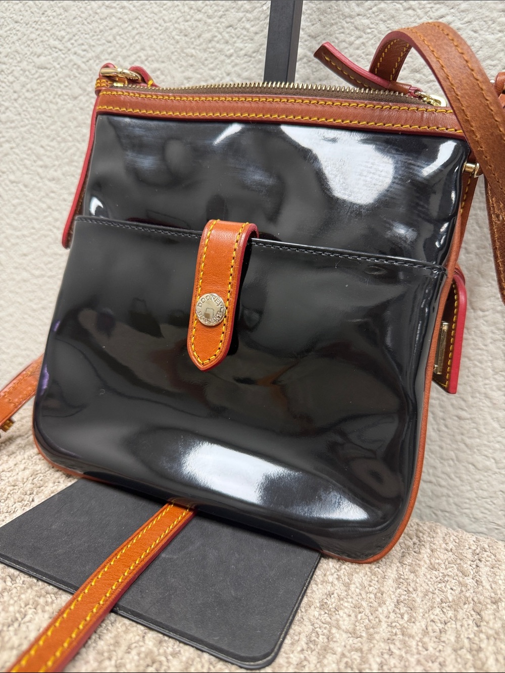 Dooney & Bourke Black Patent Crossbody with Tan Trim and Red Edge